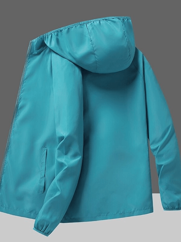 Turquoise waterproof reflective women's jacket with hood, ideal for sun protection and outdoor adventures in camping and hiking.